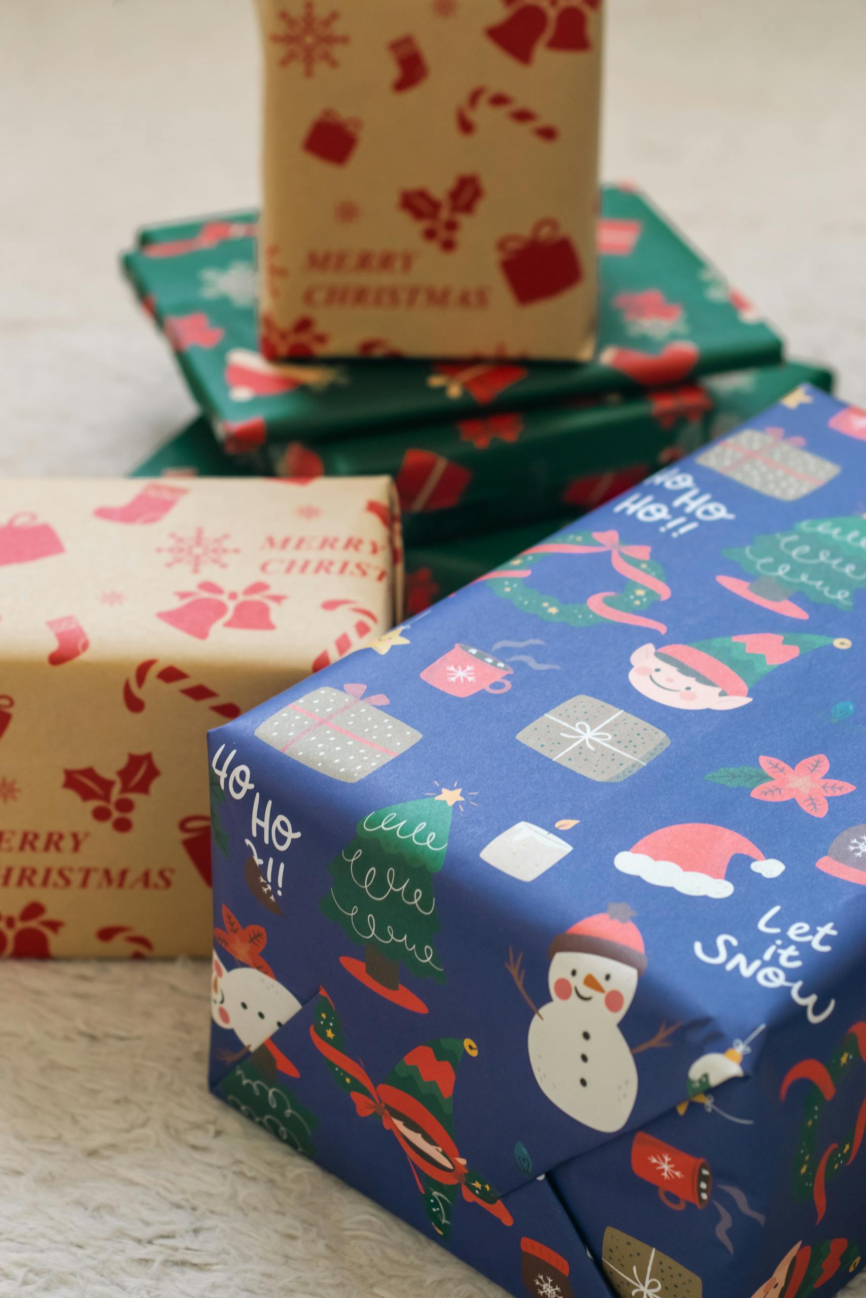 Colorful Christmas gifts with festive wrapping, featuring holiday designs and cheerful patterns.