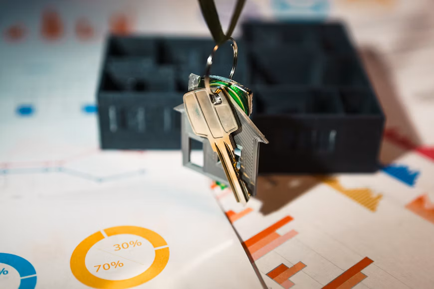 House-shaped keychain hanging from a key ring