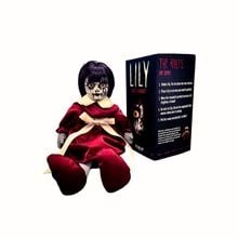 US Ghost Adventures Lily doll in a red dress beside its box