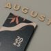 Elegant 2025 planner with decorative cover and August wooden letters.